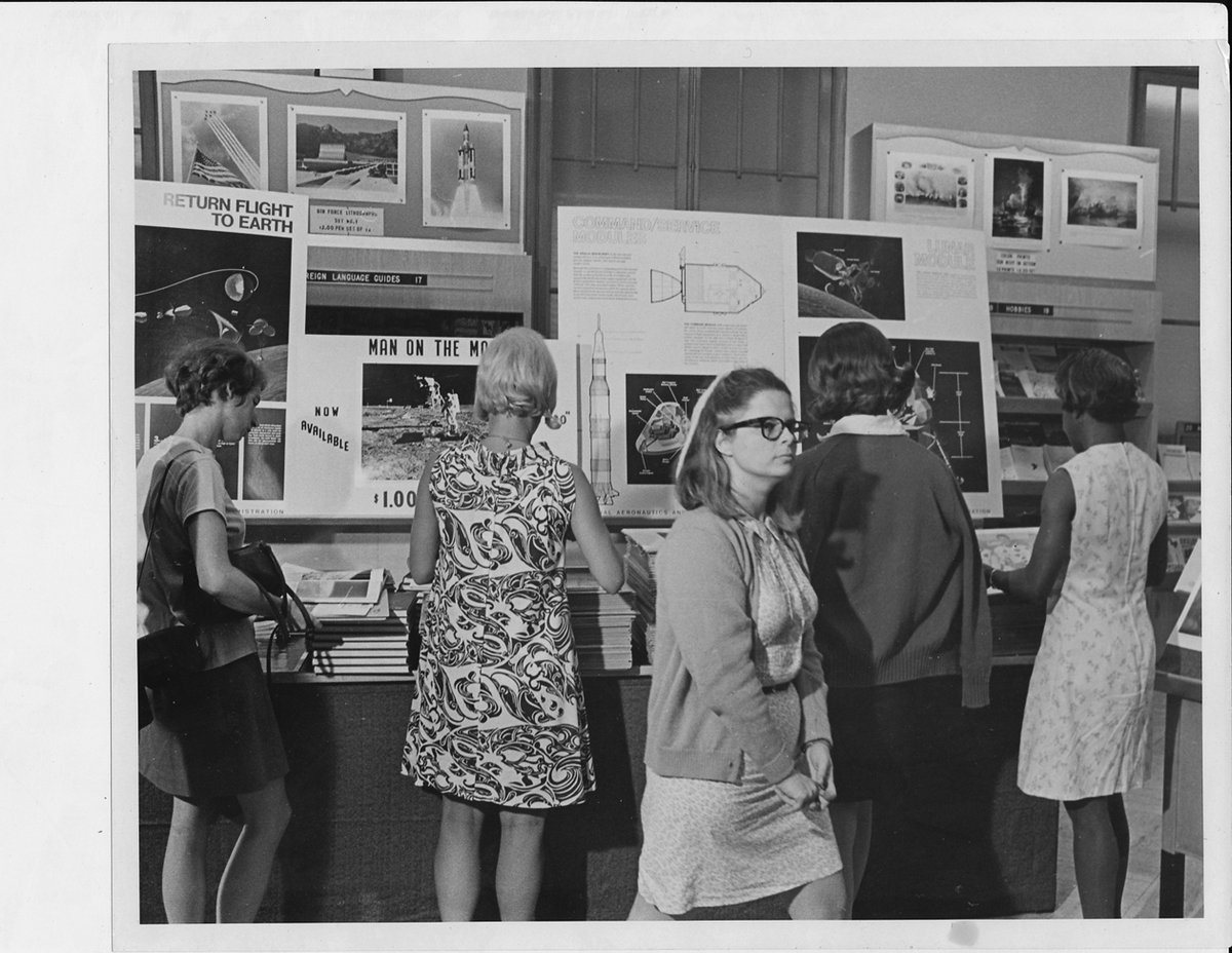 USGPO's tweet image. Today is the anniversary of the moon landing. In the days surrounding the 1969 landing of the man on the moon, the demand for @NASA & space-related publications surged. Here, a local DC news reporter interviews Public Printer Harrison in front of the Apollo 11 display at the…