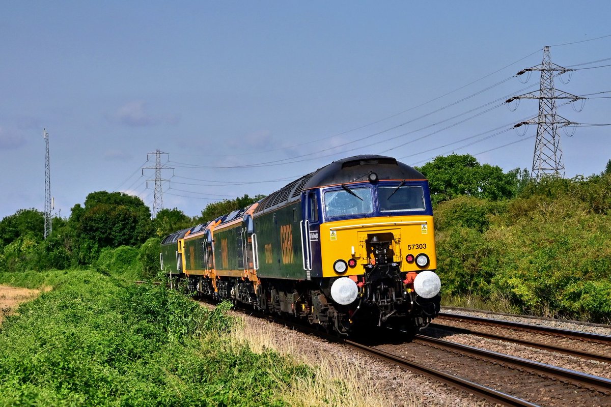 47727 with 99002, 99001 and 57303 in tow approaches Stamford on 0Q93 Peterboro Maint Shed Gbrf to Leicester LIP.