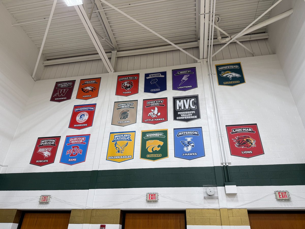 A clean and modern update to Iowa City West's gym! MVC school signs and individual signs to commermate each of their 64 state team championships!