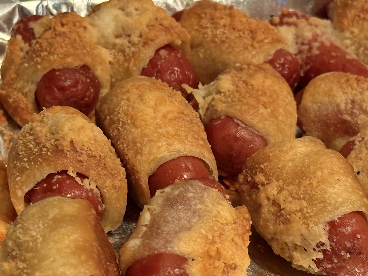 Pigs in blankets.

Cooked, butter washed, salted, then parmasean cheese and back in oven until crusted.

Dipping sauce was Mayo + Sriracha mix.