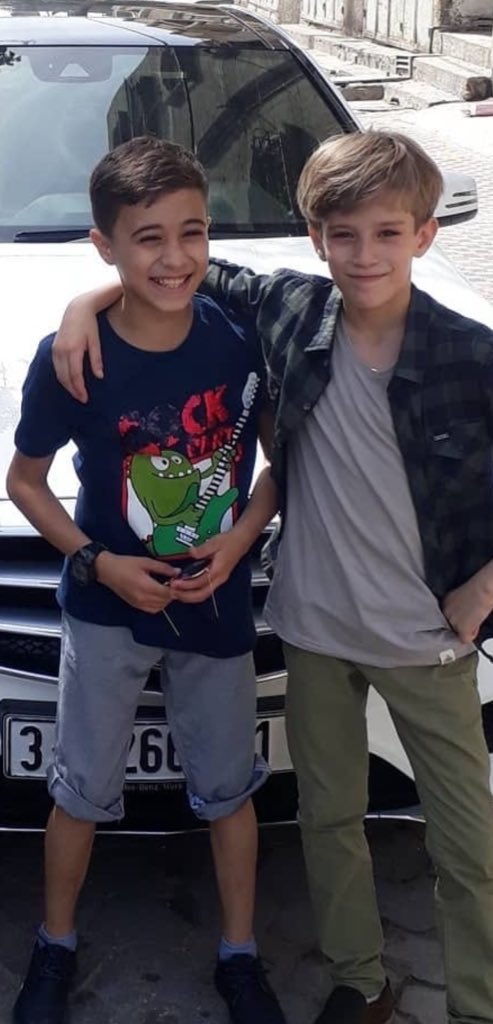 On the left is my nephew Omar, and on the right is my brother’s son, Saleh —
one soul in two bodies.

Israel killed Omar on March 18. Since then, Saleh has sunk into silence.
Each morning, he waits in line for water, then returns exhausted, surrendering to nights of hunger.