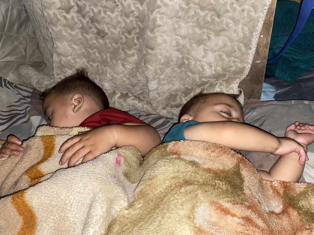 I place some wood behind my children’s heads while they sleep, hoping it might protect them from stones or shrapnel , even though I know it cannot truly do anything. But it is my desperate attempt to feel that I have done something . that I haven’t completely surrendered. For how
