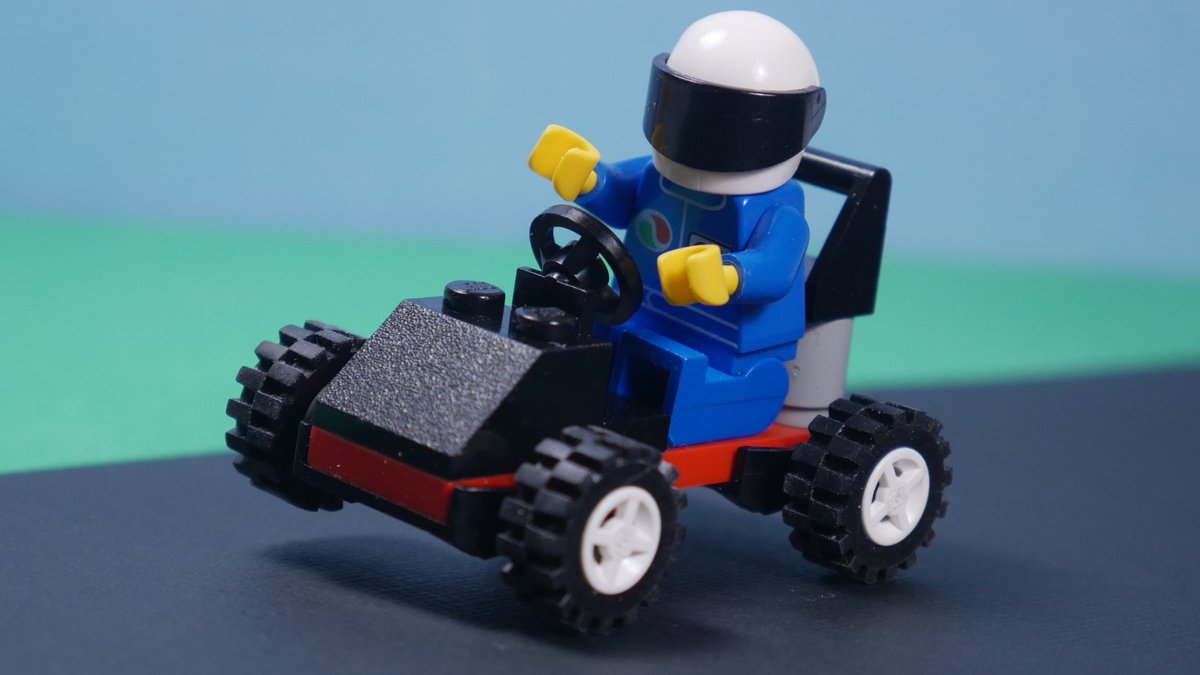 This little guy here, 1762: Go-Kart from 1995, is what I like to refer to as Barely a LEGO Set.
With a scant sixteen pieces, not counting the minifigure, this 2x6 plate with wheels is a joyful example of, "just toss some parts in a box and sell it."