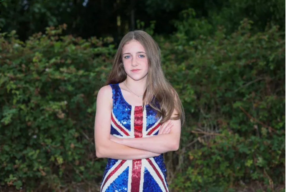 She’s twelve years old.
Straight A student. Good daughter. Proud of her country.

And for wearing a Union flag dress...on culture day...she was isolated, humiliated, and sent home like a criminal.

Her name is Courtney Wright. And every one of you needs to remember it.

Because