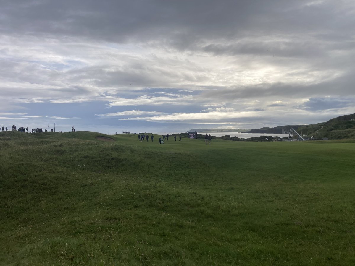 Royal Portrush looking the part as Rory McIlroy, Tom McKibbin and Darren Clarke stroll down the fifth before 8am on Tuesday morning at The Open