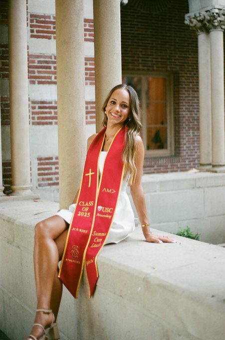 Halston Valencia graduating from USC with a red sash