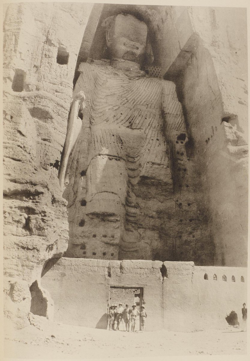 Colossal Buddha statue carved from sandstone, located in Bamiyan, Afghanistan, photographed in 1928.  Photo from National Institute of Informatics.