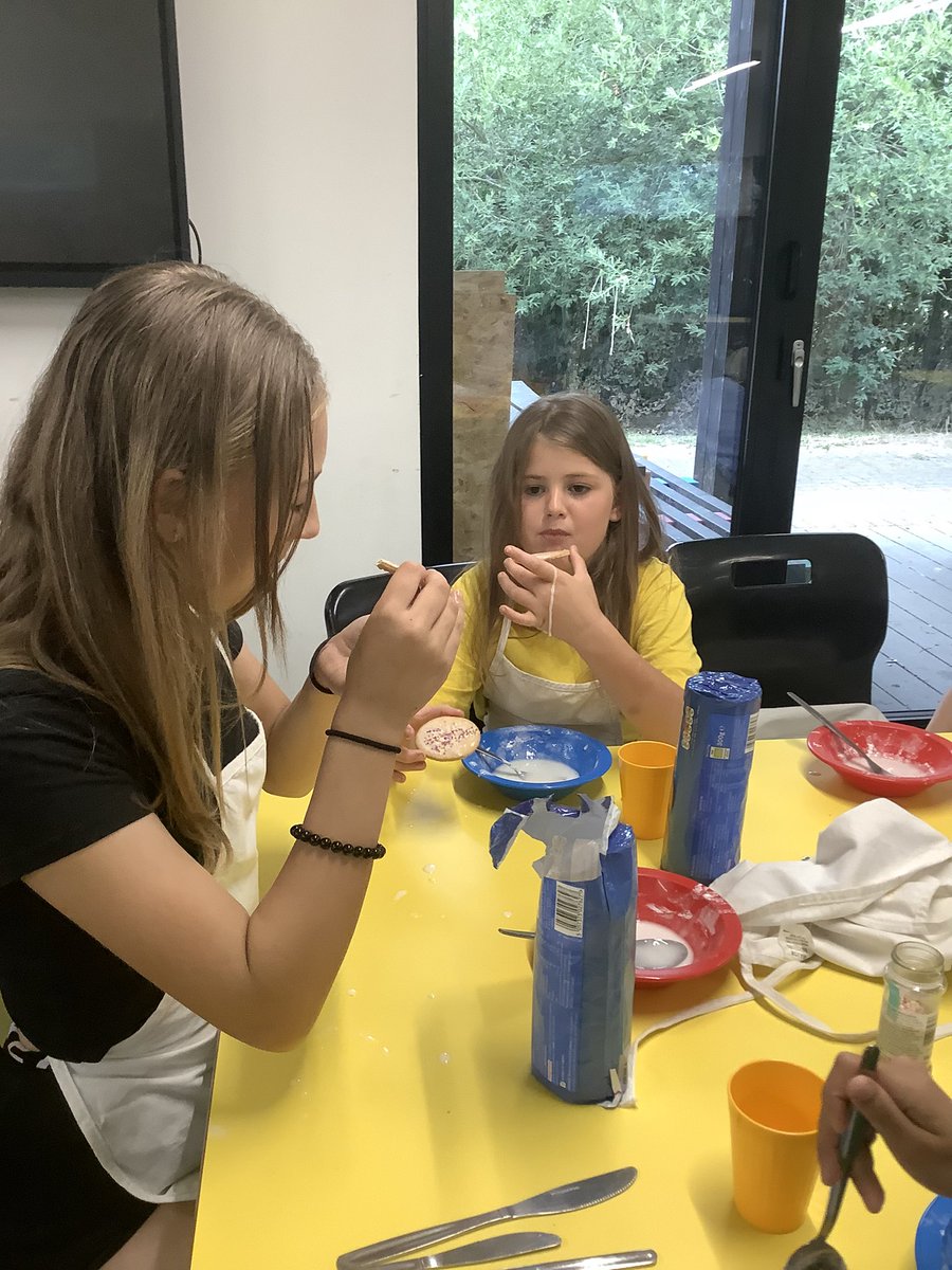 The children at the Hive have been busy icing biscuits and decorating them .