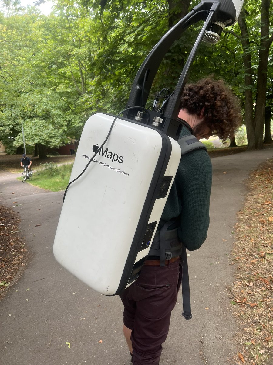 Spotted this guy today. Can anyone tell me what’s inside this  Apple Maps backpack? A giant computer? 🤔