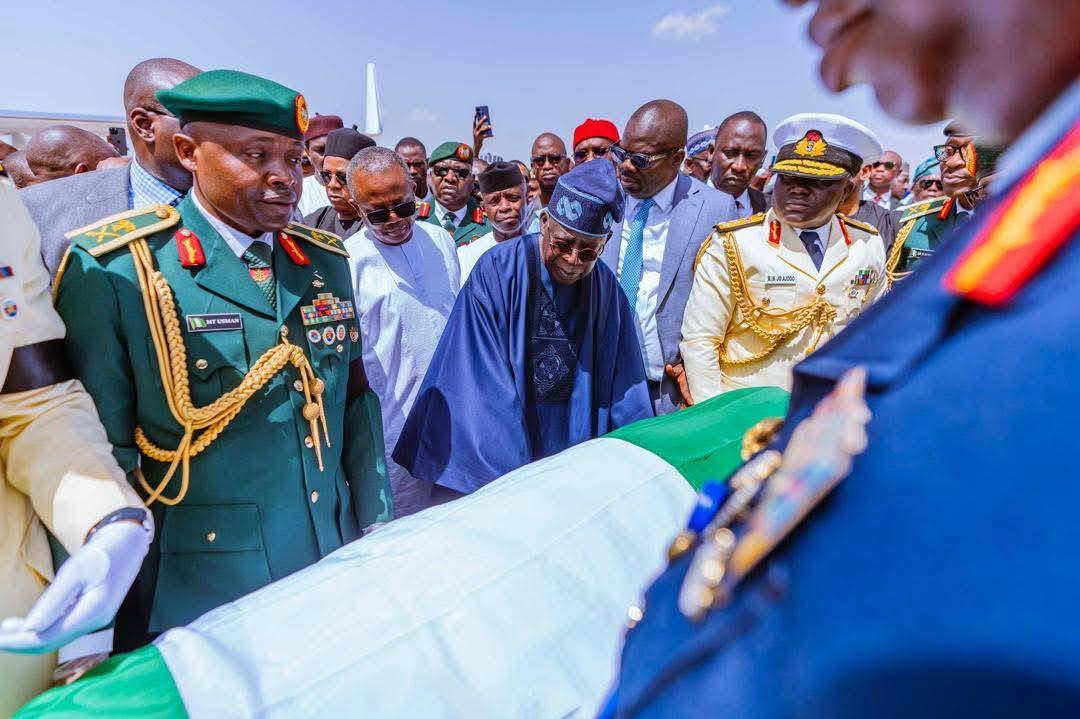 EnuguState's tweet image. The body of former President Buhari touches down on Katsina’s solemn soil
A final journey begins, not in power, but in silence.
He returns to Daura, the land that shaped his rise,
Where dust and memory shall cradle him in rest
The echoes of his reign fade into the northern wind
