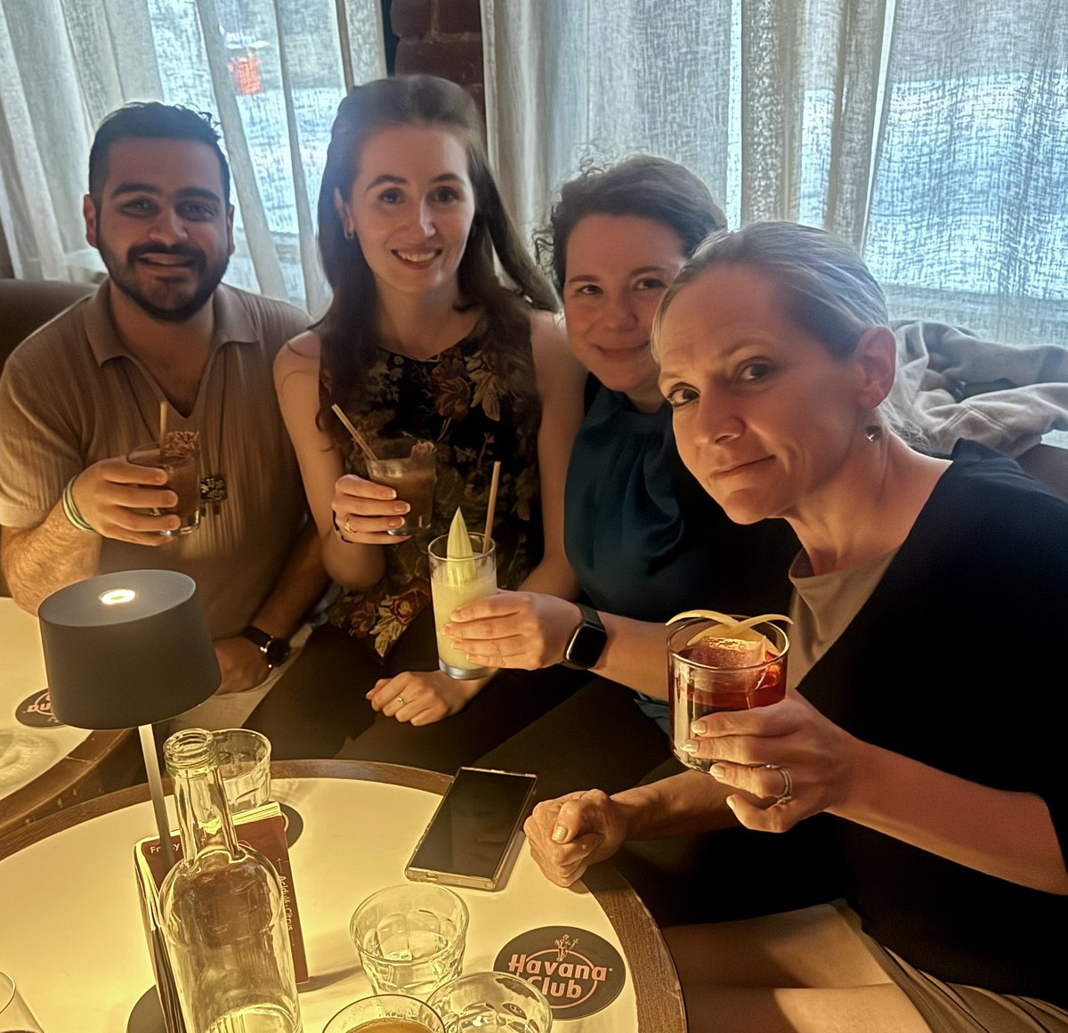 angie_rasmussen's tweet image. Celebrating the future of virology @Rasmussen_Lab style…with fancy cocktails and sarcasm. L to R: @AhRooddehghan, Marin Habbick, @HeatShock_Helen, the PI footing the bill