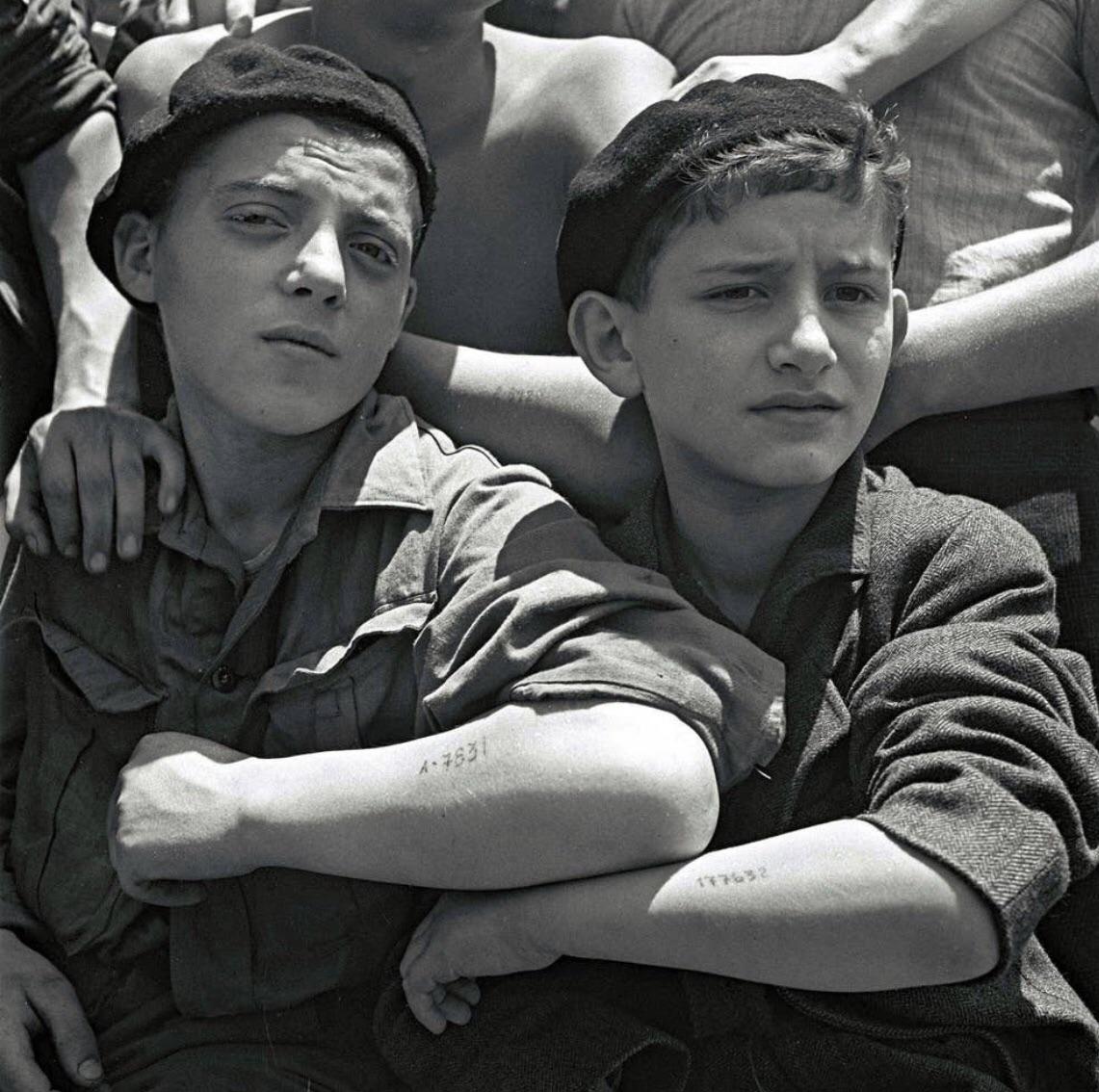 WW2Facts's tweet image. Jewish youths rescued from Auschwitz show their camp tattoos while aboard a refugee ship on July 15, 1945.
#History #WWII