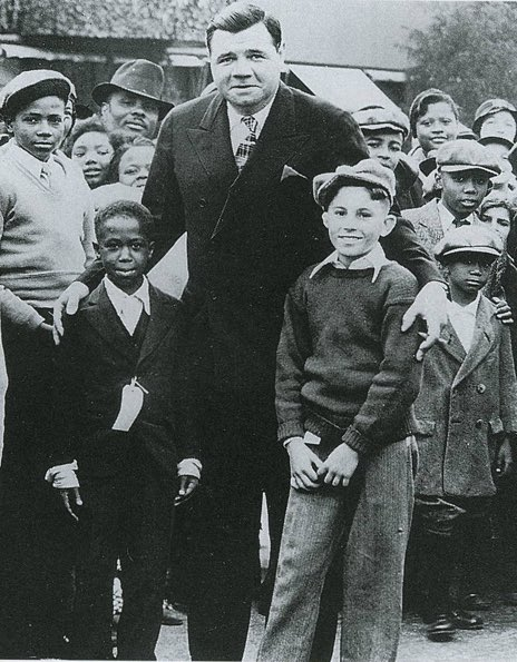 Babe Ruth with young fans.