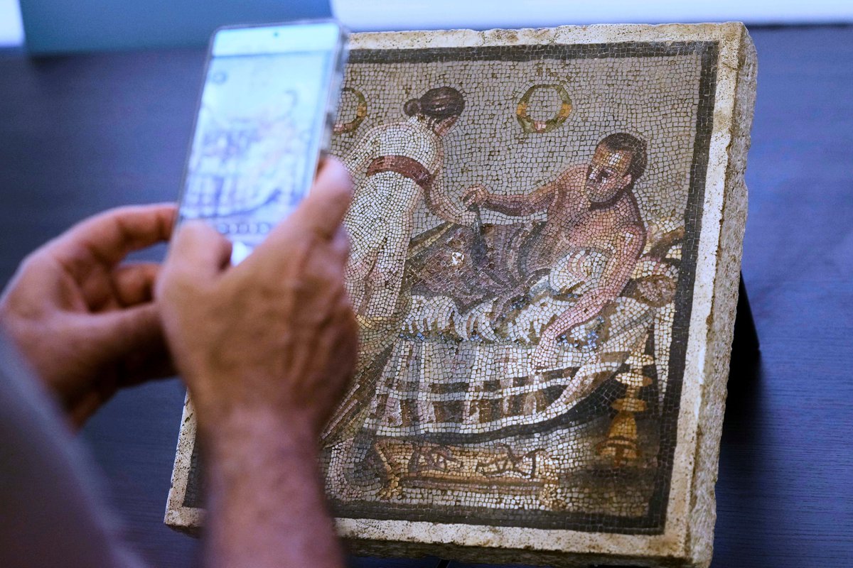 DeccanChronicle's tweet photo. A #mosaic panel on travertine slabs, depicting an erotic theme from the #Romanera, was returned to the archaeological park of #Pompeii, Italy after being stolen by a #Nazi German captain during #WorldWarII - AP Photos https://t.co/EEowUoHIFL