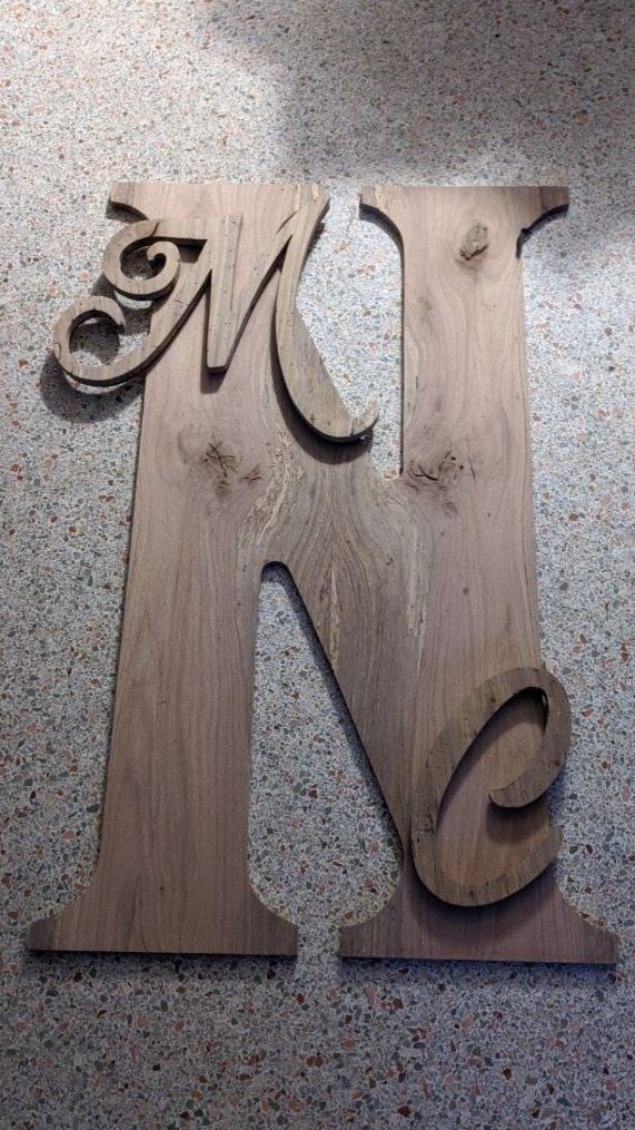 Rather than a wedding guestbook, my daughter opted to have me make a giant letter N (2' x 3') out of spalted white oak that people can sign with paint markers. 
Pretty brilliant idea that I could pull off, so it works.