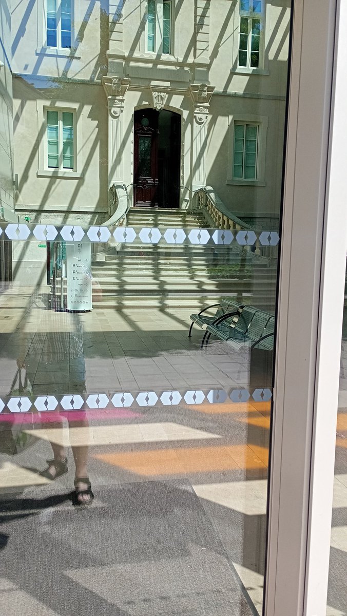 Yes, that's a modern glass box of a building with the old staircase and door façade inside.