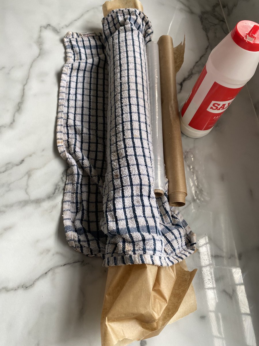 pollypantries's tweet photo. Vanilla Swiss roll out and rolled up with damp cloth over it ! I use any weights I can to keep the rolled edge in the correct position! Leave till cold #swissroll #vanilla #cake https://t.co/LohmNRyXjR