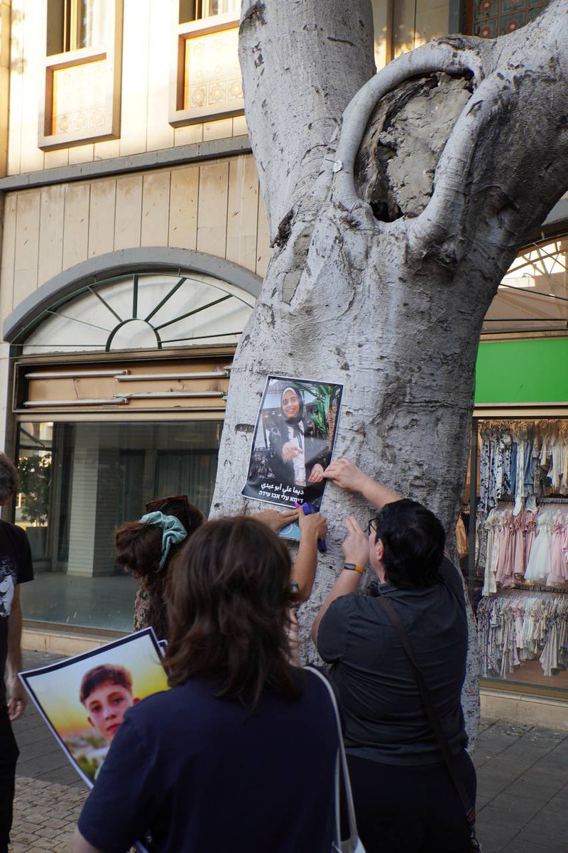We just put up hundreds of posters of Palestinian children who were killed in Gaza across Tel Aviv. Each one includes the name and image of these children, who our government prefers we forget. (1/2)
