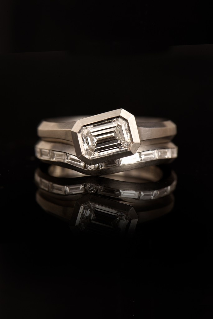 Chunky wedding band and engagement rings are on trend. We have been making them for years.

The Arris platinum curved fitted wedding band with baguette diamond stacks perfectly with our asymmetric Arris engagement ring. 

mccaul.com/products/plati…