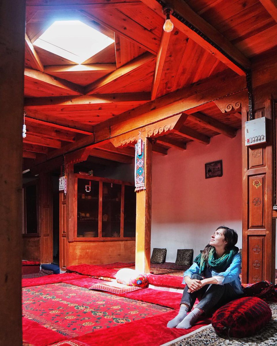 Caption:
Eva zu Beck captured in the warm setting of a traditional Wakhi home in Jamalabad, Gojal, Hunza the Sifat Shah House. This beautifully preserved space reflects the architectural soul of Wakhi and Tajik heritage, with intricate wooden