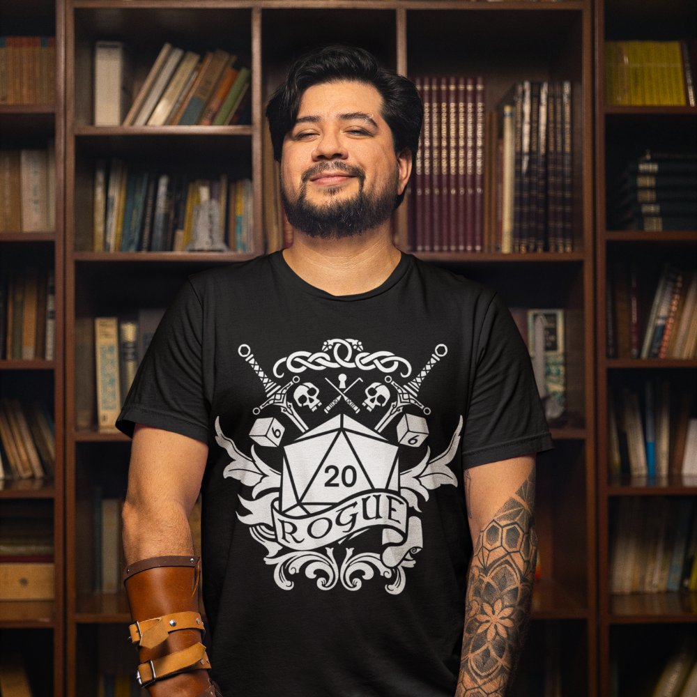 For those who prefer their damage with a side of sneak - these rogue-themed shirts let everyone know you've got expertise in looking sharp. Just remember: wearing this doesn't actually grant you advantage on stealth checks.

artofarklin.etsy.com
#ArtOfArklin #DnD #TTRPG