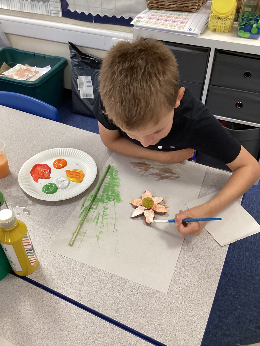 This afternoon in year 4 we are painting our clay flowers and stems.