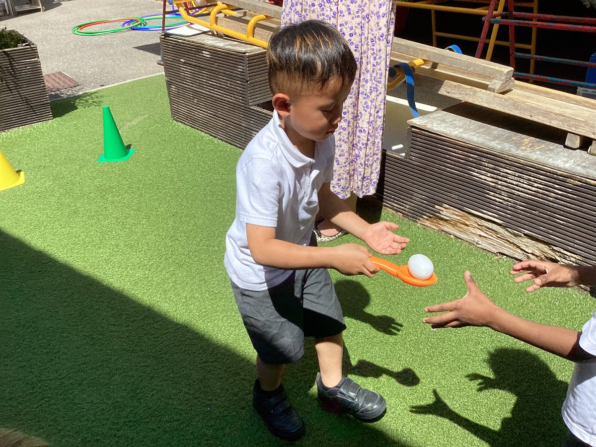 Nursery had fun practising relay activities and working in colour teams.