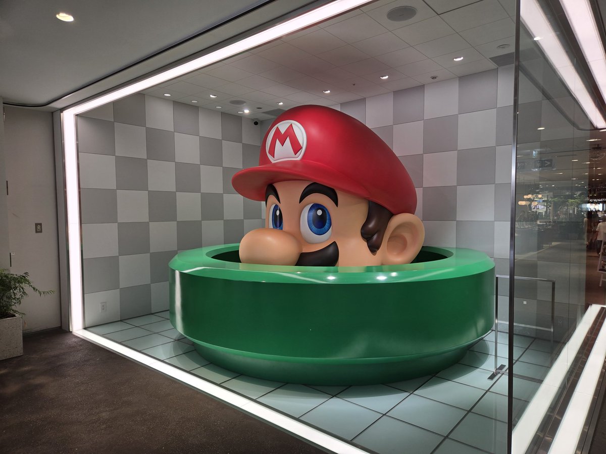 Agentdave7's tweet image. I went to @N_Officialstore in Kyoto and then to @Museum_Nintendo. I made a new friend that really likes Nintendo and Disney also! We tried playing Super Mario Kart using the giant SNES controller.