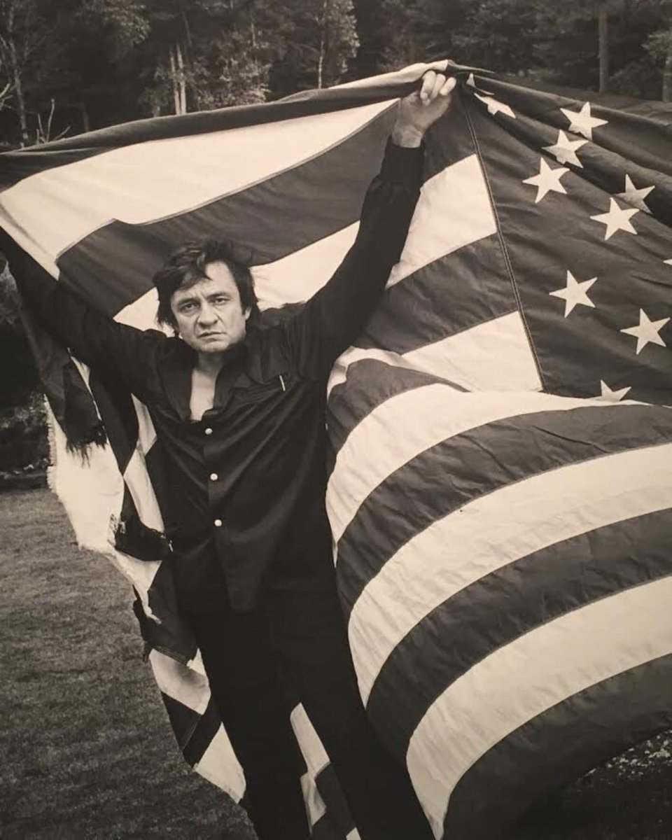 BSHQ's tweet image. We hope you have a safe and wonderful Fourth of July! Throwback to this legendary photo of @JohnnyCash posing with an old American flag on top of Grandfather Mountain, circa 1974.
Image credit: Hugh Morton.
#johnnycash #country #4thofjuly