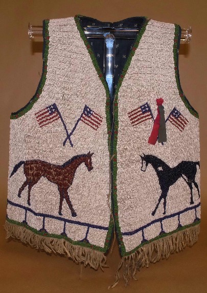 American flag imagery is a popular motif of Lakota beadwork spanning the 19th century to today. As a powerful form of artistic expression, these pieces stand as complex symbols by their creators. This vest was collected between 1900-1915 by Albert Wentzy.