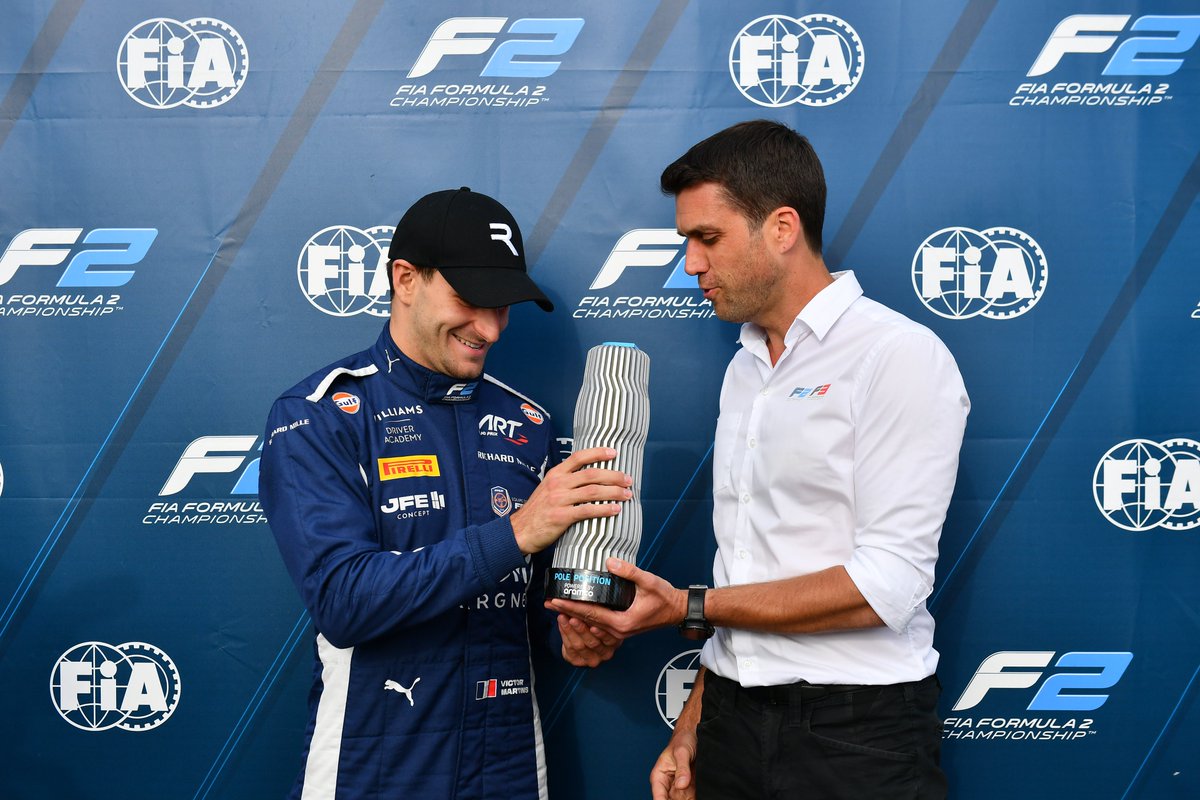 Formula2's tweet photo. Victor Martins was the winner of the @aramco Pole Position Award at Silverstone! 👏

F2 Technical Director, Pierre-Alain Michot, was on hand to give Victor the trophy! 🏆

#F2 #BritishGP https://t.co/4gHg9RC7JA