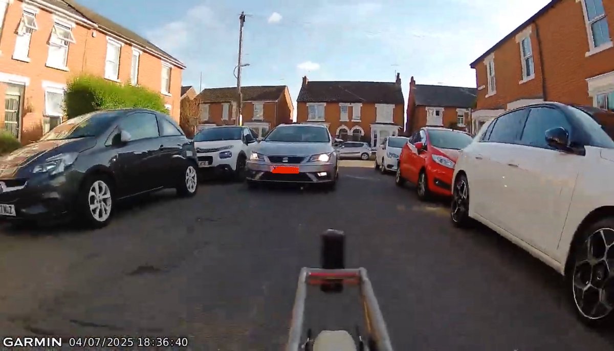 Not sure why this taxi driver thinks blowing his horn will make this road wide enough to pass safely