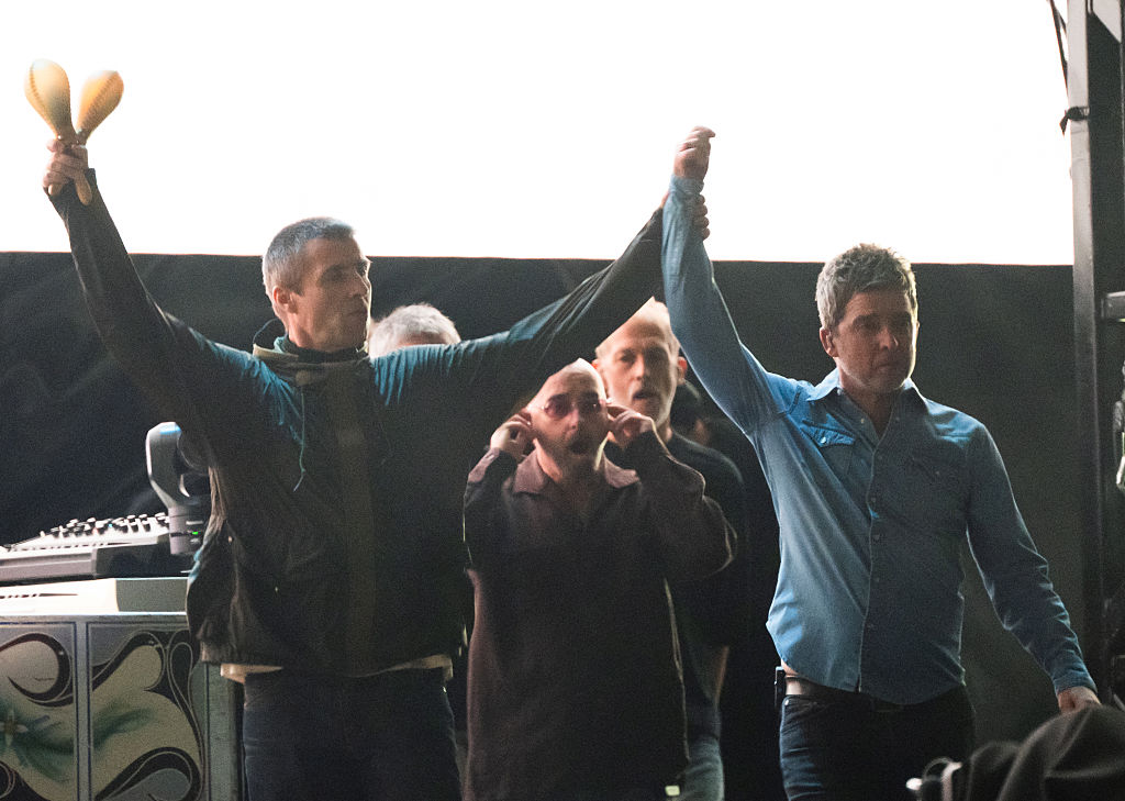 kroq's tweet image. Welcome back, @oasis! Their first reunion gig is underway at Cardiff's Principality Stadium.
(📸 Samir Hussein/WireImage, Gareth Cattermole & Matthew Horwood/Getty Images)