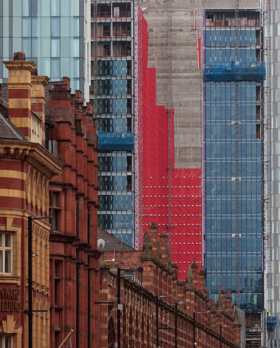 Today's view from Deansgate, Manchester, with a tiny fluorescent-jacketed builder included for scale