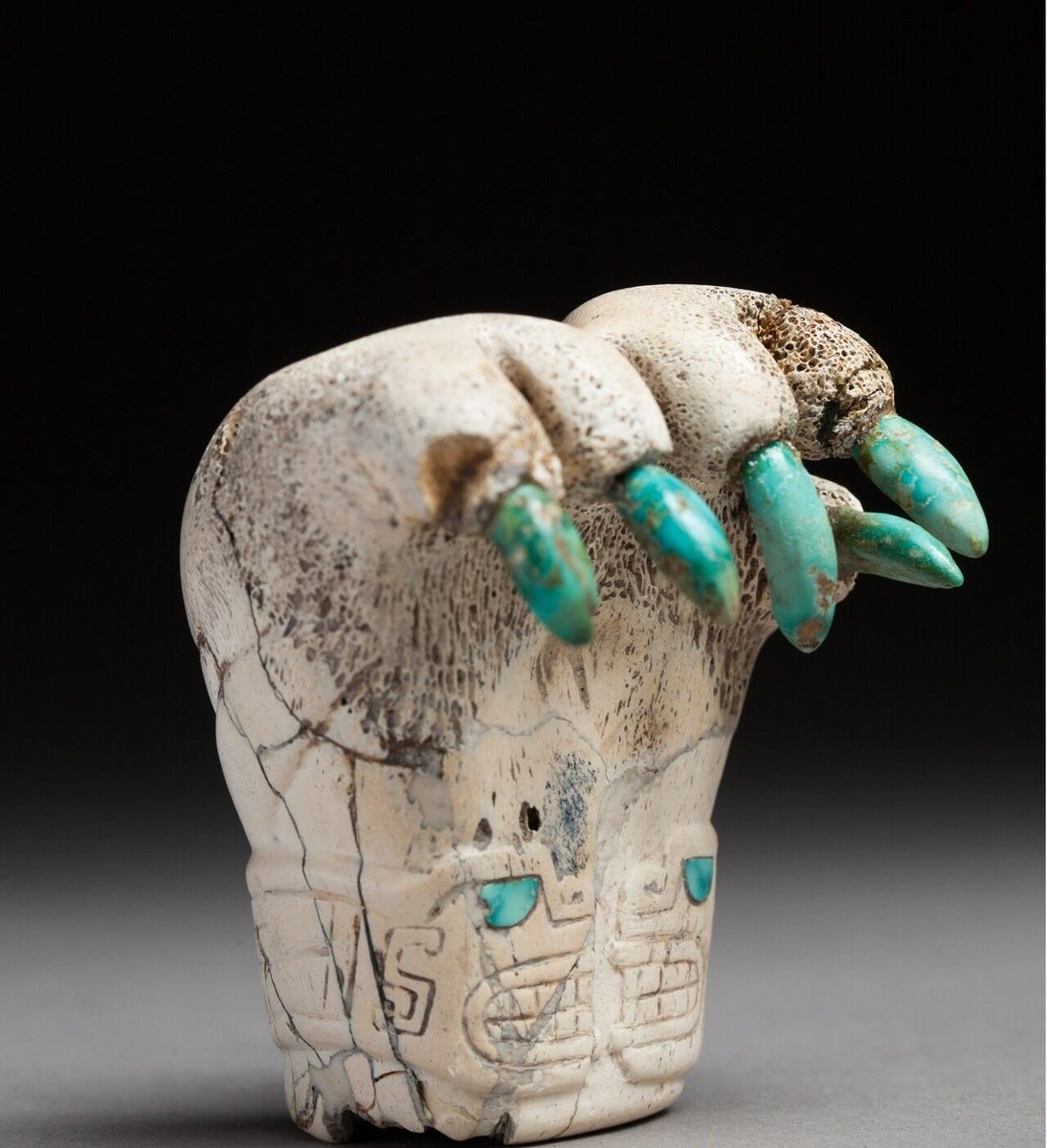 Jaguar paw sculpture, made of human bone with turquoise-inlaid claws; Peru, 700-400 BC.