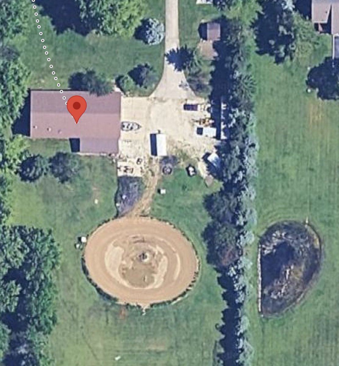 ChrisWilke11's tweet photo. It took me about 10 years, but I managed to build a 1/21 mile replica of belleville Kansas in my backyard @BellevilleHB banked 28 degrees https://t.co/zI418rPlKD