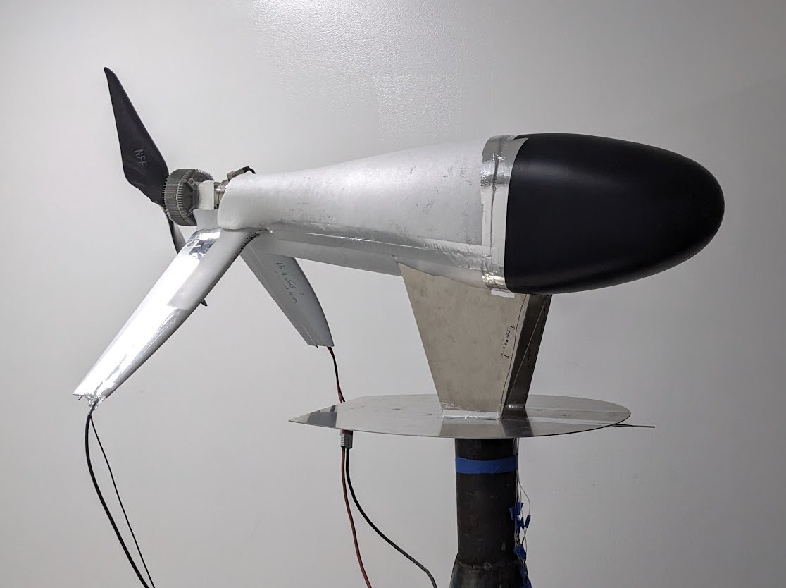 Keller's tweet image. 1st day of testing for new mixed propeller design using our in house wind cannon. Test aero setup looks like a futuristic Zipline product 🤔