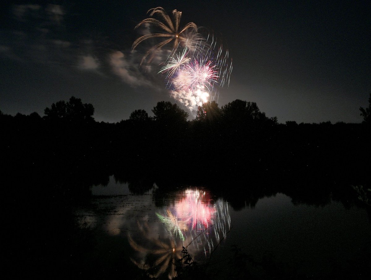 TribStarJoe's tweet image. Fireworks are reflected in the water at the Wabashiki Fish & Wildlife Area during the show Friday evening over the Wabash River near Fairbanks Park.