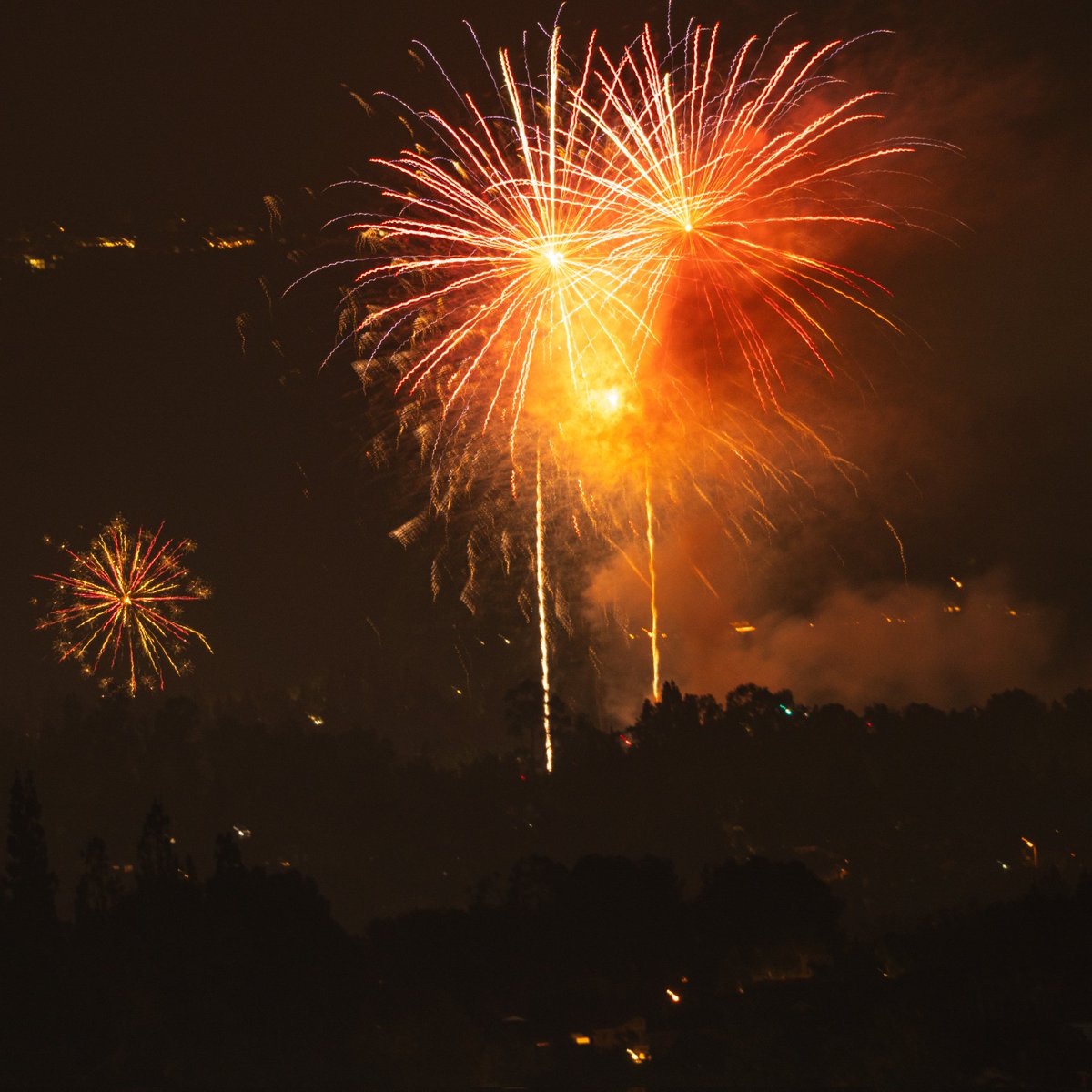 I photographed two different municipal fireworks shows from several miles away with my 400-800mm long lens.