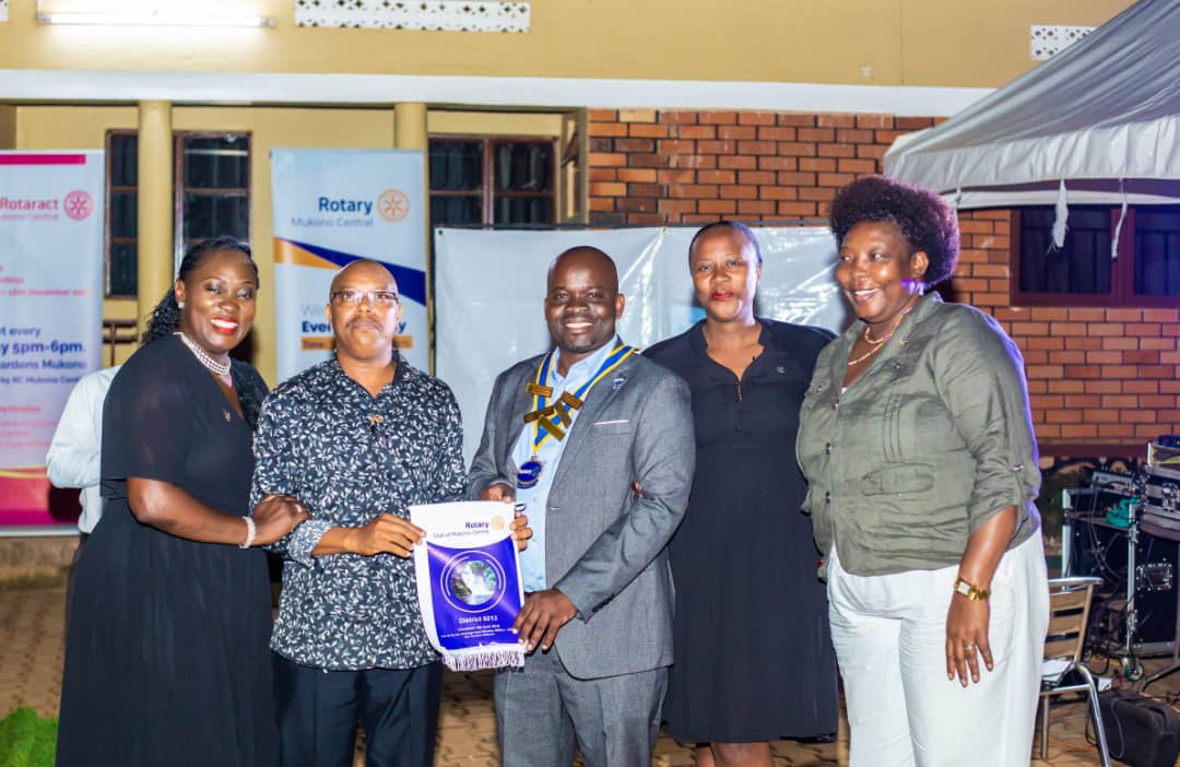 Receiving a banner from RC Mukono central.