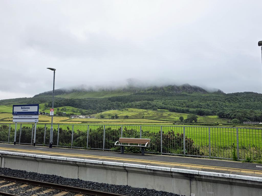 Rain clouds coming down over Binevenagh Mountain, Limavady  towards once of the most scenic railway stations,  Bellarena