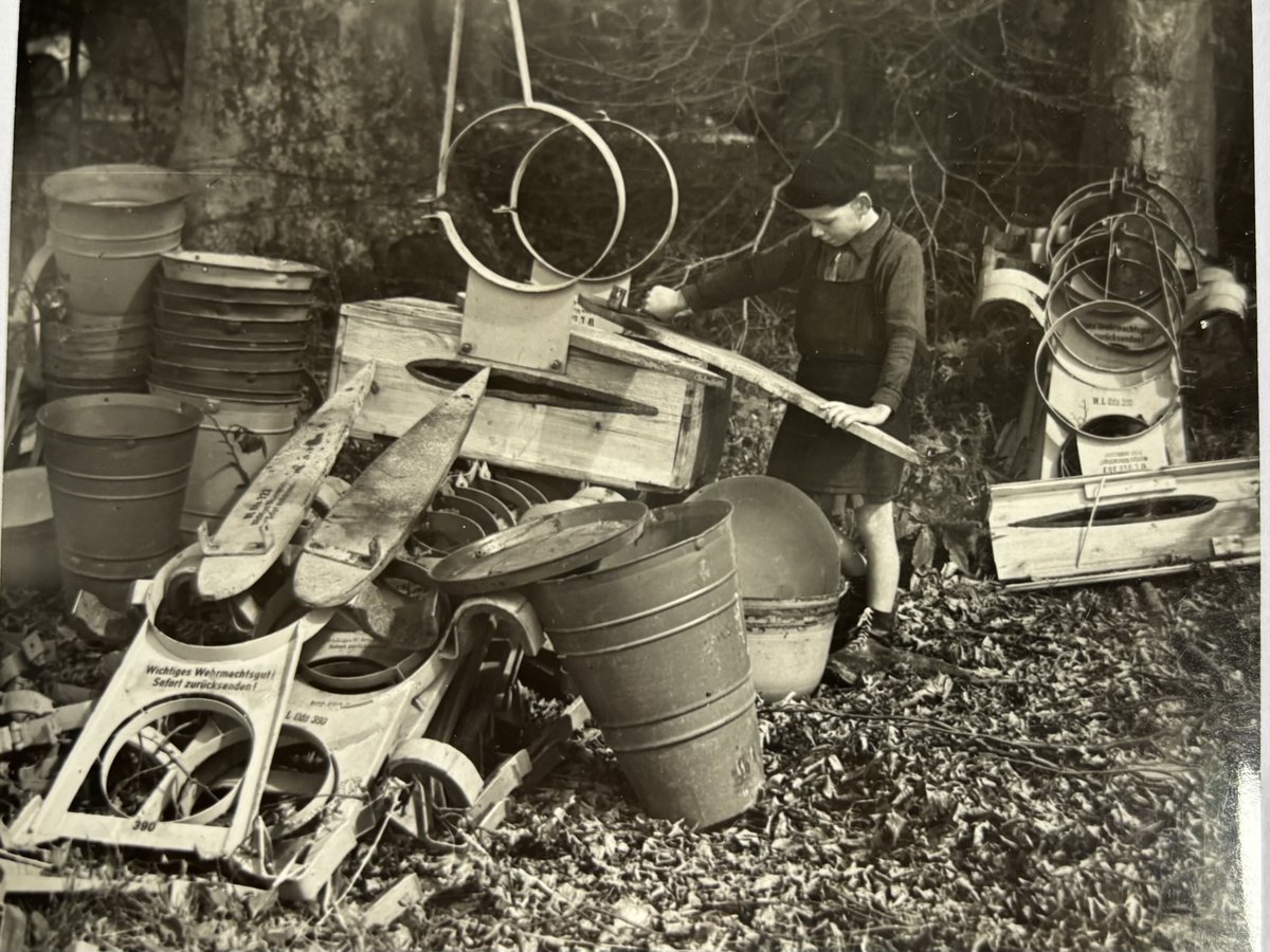 Still sorting through my V1 and V2 photo archive. Here, a young French boy looks at discarded transportation ‘packaging’ for V1s, including brackets to hold wings/tail units etc. The strange bucket items are presumably protective covers for warhead/nose assemblies.