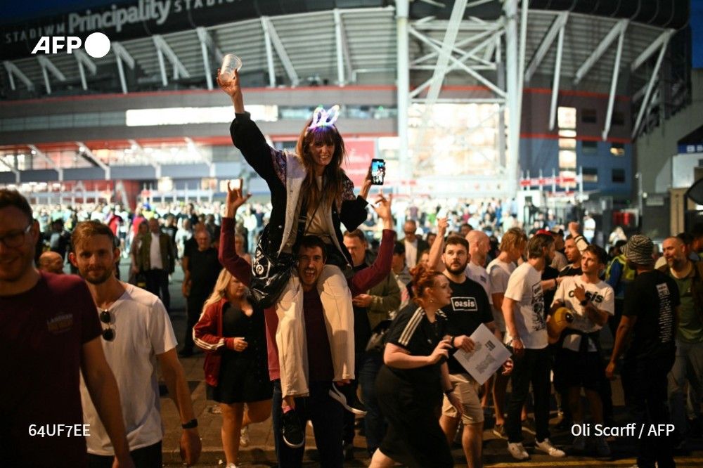 Oasis fans outside the Principality Stadium in Cardiff on July 4, 2025, after attending the opening concert of their highly anticipated reunion tour