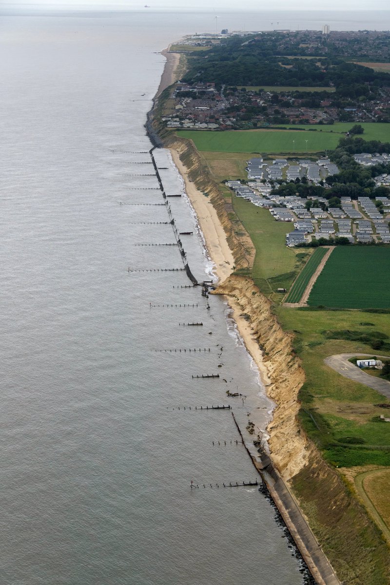 johnfielding001's tweet photo. Failing sea defences at Corton in Suffolk. The original timber breastworks/groynes were installed here in 1899-1900. They have been replaced and upgraded periodically ever since. Corton aerial image #Corton #aerial #image #Suffolk #Coast #AerialPhotography https://t.co/9h101DERJM