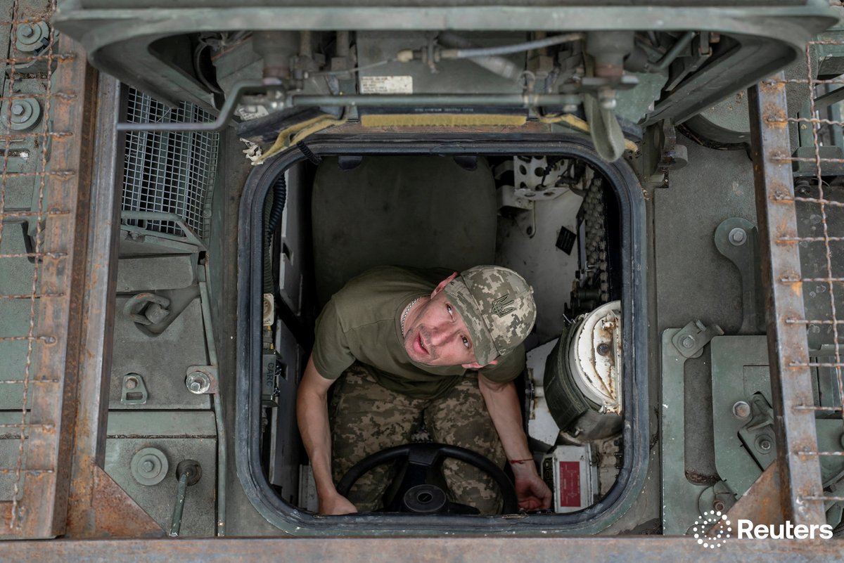 A service member of the 81st Separate Slobozhanska Airmobile Brigade of the Ukrainian Armed Forces sits inside a Stryker APC during exercises at a training ground in Donetsk region, Ukraine. More photos of the week: reut.rs/4ldbGNr 📷 Viacheslav Ratynskyi