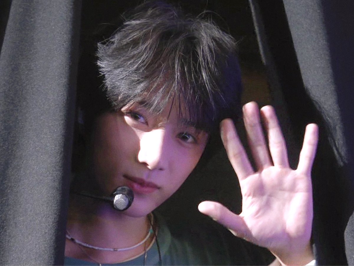 after the handsome guy sitting on a chair we now have a new title: the handsome guy waving from the curtain