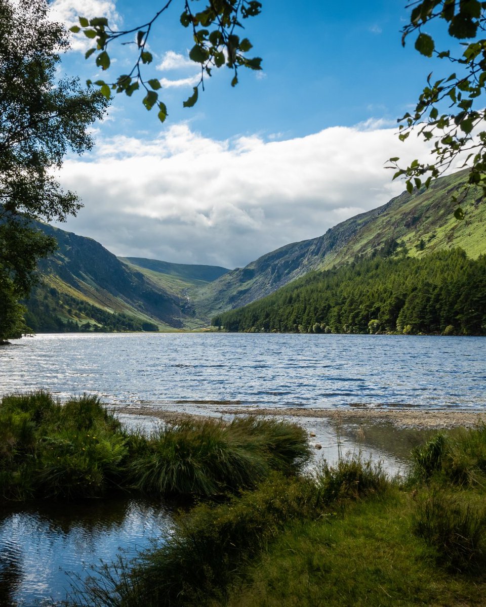 The upper lake in Glendalough. this body of freshwater is in a glacial valley in Co. Wicklow Ireland not far from Dublin and is a popular beauty spot enjoyed by tourists hiking walking sightseeing