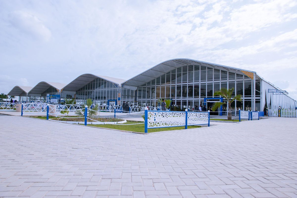 President Samia Suluhu Hassan, unveiling a cloth as a symbolic gesture of laying the foundation stone and cutting the ribbon to inaugurate the Arise and Shine Church in Kawe, Dar es Salaam and thereafter greeting the congregants of the Arise and Shine Church at the inauguration