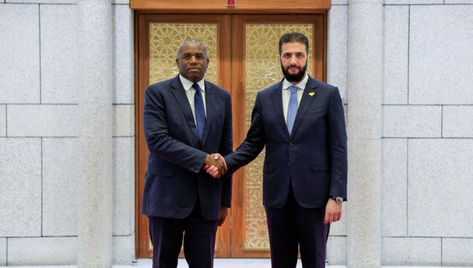 soopagaz's tweet image. David Lammy here, shaking the hand of the ex-ISIS leader.

But, don’t you even think about wearing a Free Palestine T-Shirt.