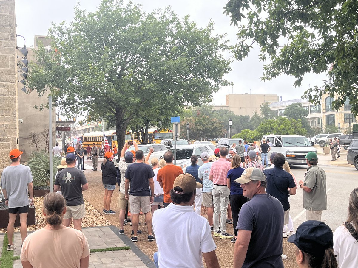 EvaRuth's tweet image. As choppers search from above, campers from an all-girls camp reunite with cheering parents in downtown Kerrville. Counselors from nearby camps help load and unload trunks.